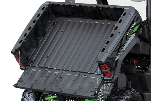 Front angle of the raised cargo bed of a side x side staged in a white studio background. opens in a new window