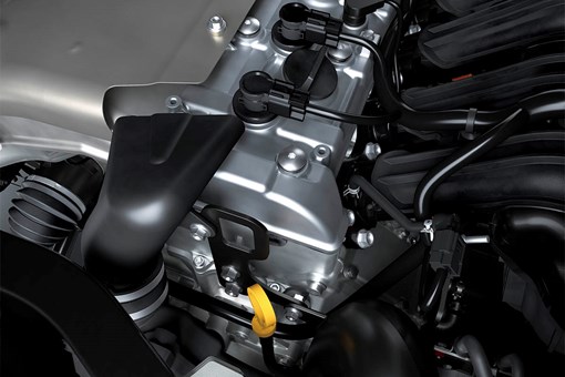 Close-up view of the four-cylinder engine in a side x side. opens in a new window