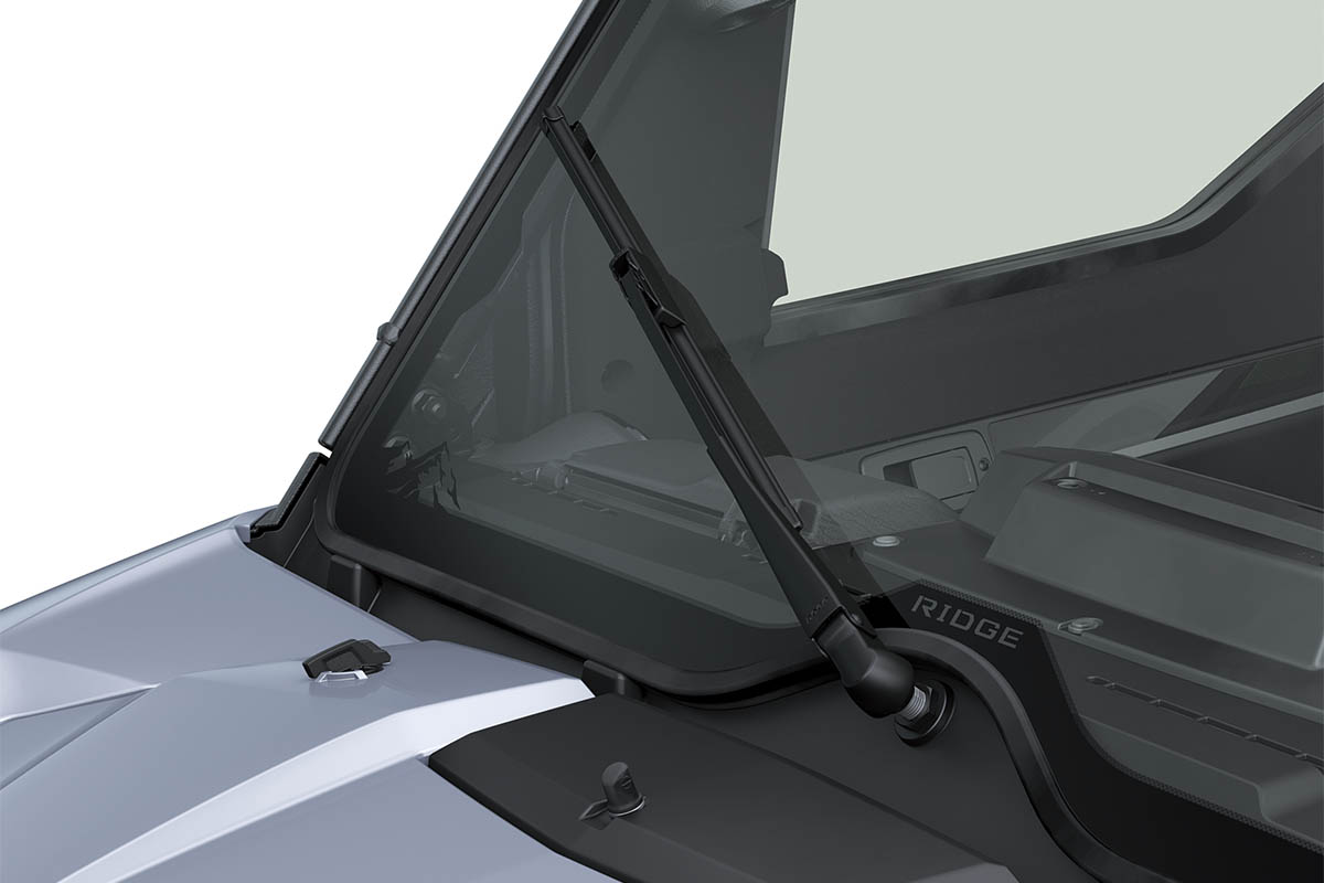 Close-up view of the windshield wiper of a side x side staged in a white studio background.