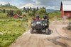 Front angle of a person driving a side x side off-road.