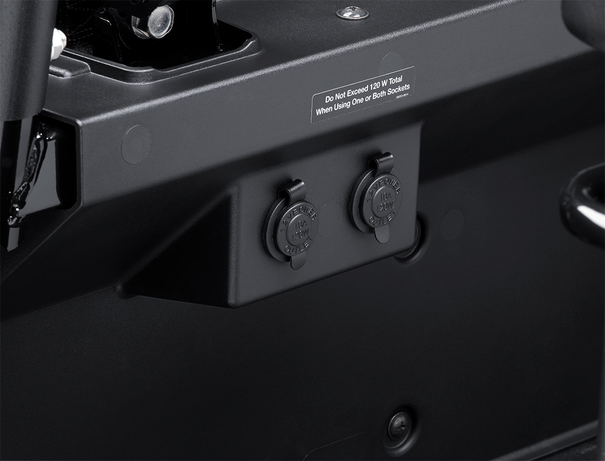 Interior view of a side x side showing two power outlets.