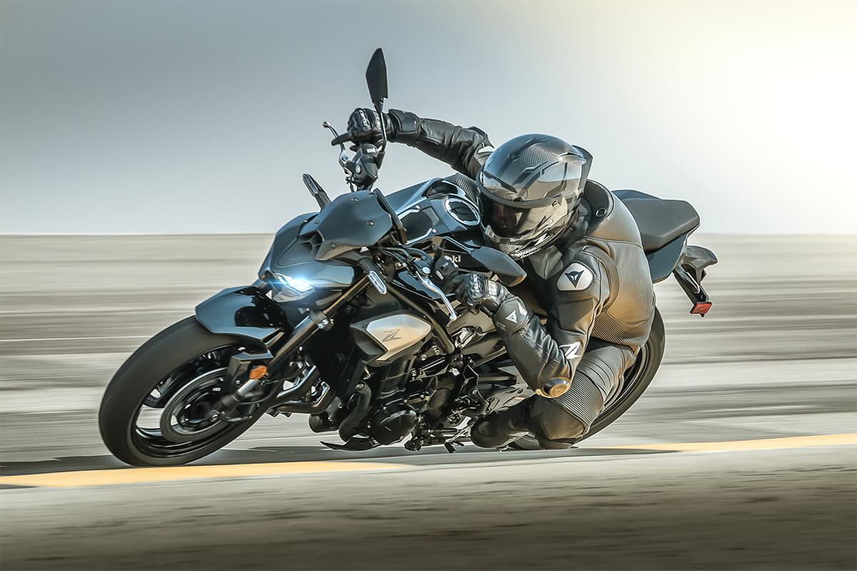 Profile angle of a person dragging knee on a track.