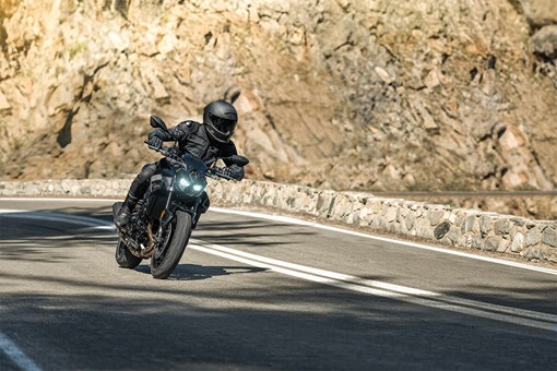 Three-quarter front angle of a motorcycle in the mountains. opens in a new window