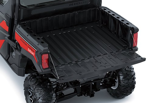 Top-down view of cargo bed of a side x side with the tailgate down. opens in a new window