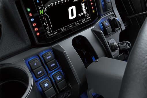 Interior detail of a side x side's dashboard with accent lighting. opens in a new window