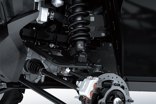 Detail view of front right A-arm, shock and brake rotor of a side x side. opens in a new window