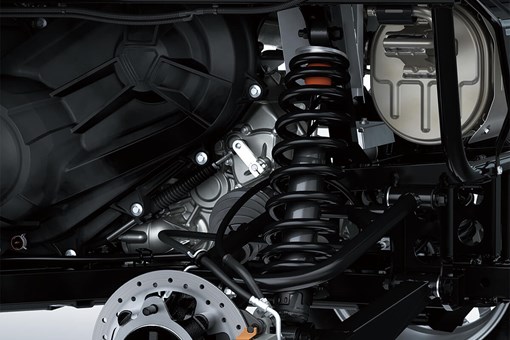 Detail view of rear right suspension system and brake rotor of a side x side. opens in a new window