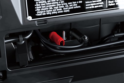 View of battery junction and terminals behind the dashboard of a side x side. opens in a new window