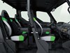 Profile view of interior of a side x side showing passenger seating in white studio background.