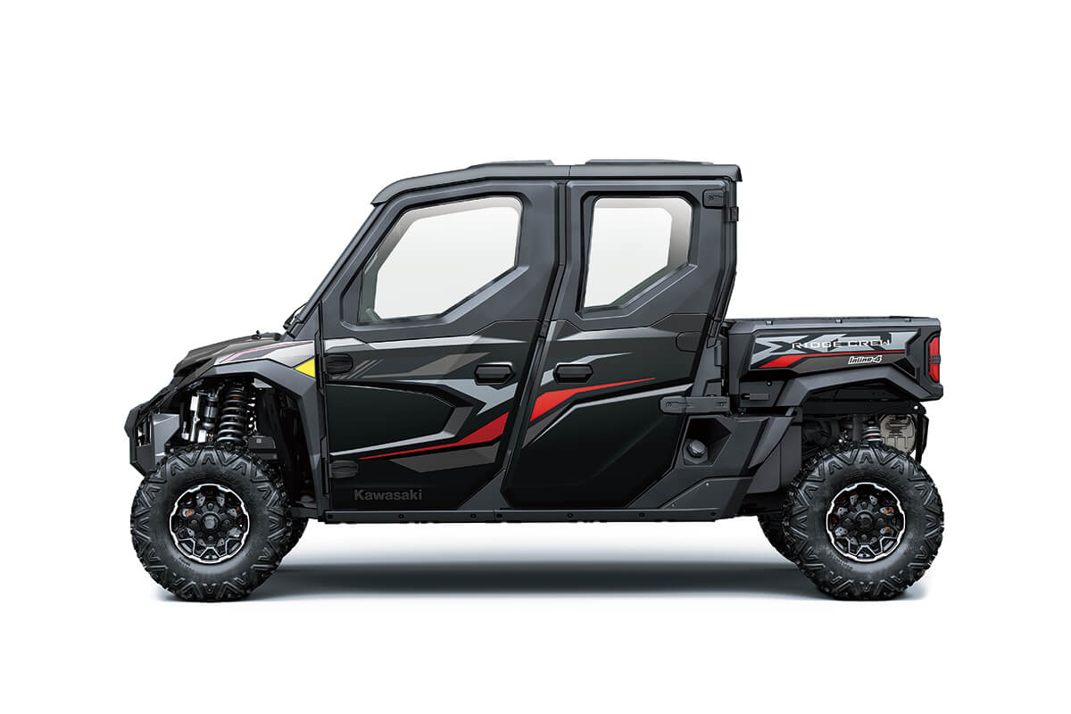 Left side view of a black and red side x side staged in a white studio background. 