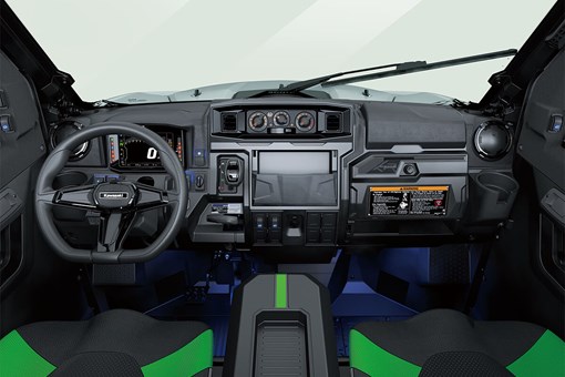 Interior cabin view of the front dash and controls of a side x side. opens in a new window