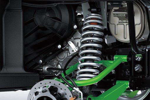 Detail view of rear right suspension system and brake rotor of a side x side. opens in a new window