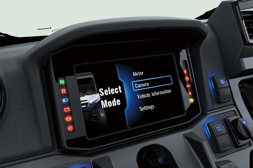Closeup view of the instrument panel and mode functions of a side x side. opens in a new window