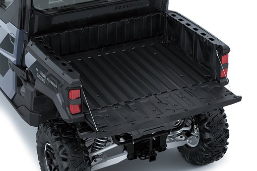 Top-down view of cargo bed of a side x side with the tailgate down. opens in a new window