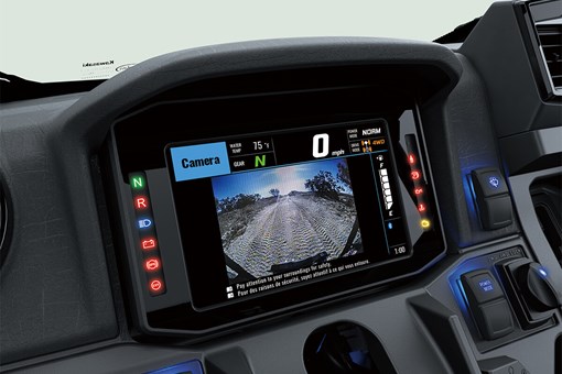 Closeup view of a full-color instrument panel of a side x side. opens in a new window