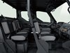 Profile view of interior of a side x side showing passenger seating in white studio background.