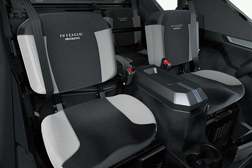 Interior view of front seating inside a side x side with center console. opens in a new window