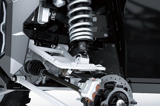 Detail view of front right A-arm, shock and brake rotor of a side x side. opens in a new window