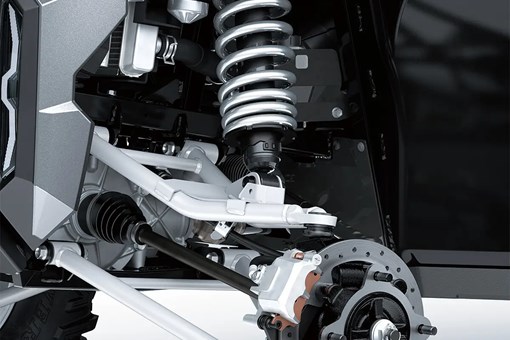 Detail view of front right A-arm, shock and brake rotor of a side x side. opens in a new window