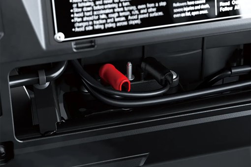 Interior view of battery junction behind the dashboard of a side x side. opens in a new window