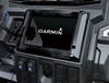 Interior dash of a side x side showing integrated Garmin screen.