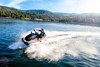 Front view of a person on a personal watercraft on the water.