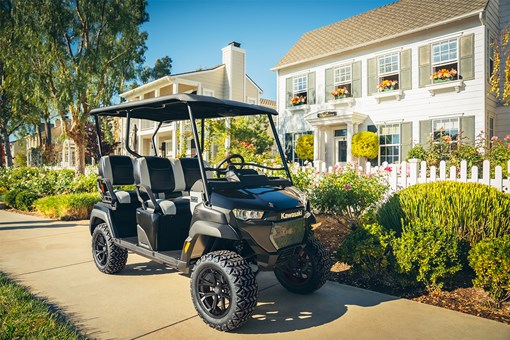 Three-quarter front angle of a Neighborhood Activity Vehicle parked on a driveable sidewalk. opens in a new window