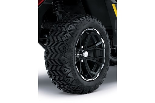 Close-up view of the tire of a Neighborhood Activity Vehicle staged in a white studio background. opens in a new window