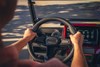 Driver POV of a person driving a Neighborhood Activity Vehicle on a community roadway.