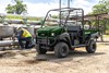 Three-quarter front angle of a side x side parked off-road.