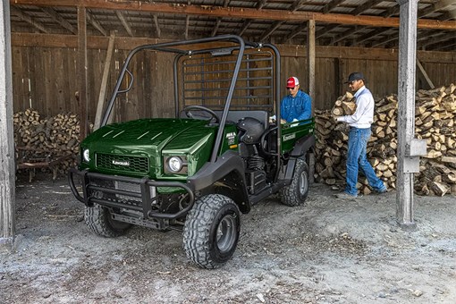 Three-quarter front angle of a side x side parked in a barn. opens in a new window