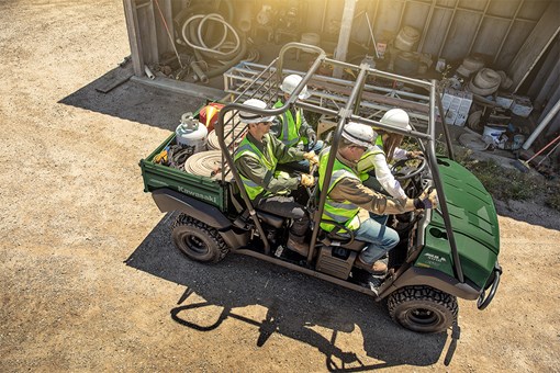 Aerial view of four people driving a side x side off-road. opens in a new window