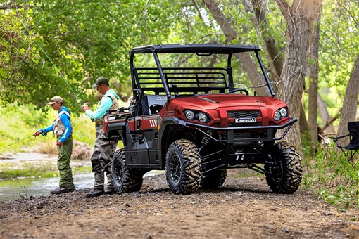 Three-quarter front angle of a side x side parked off-road. opens in a new window