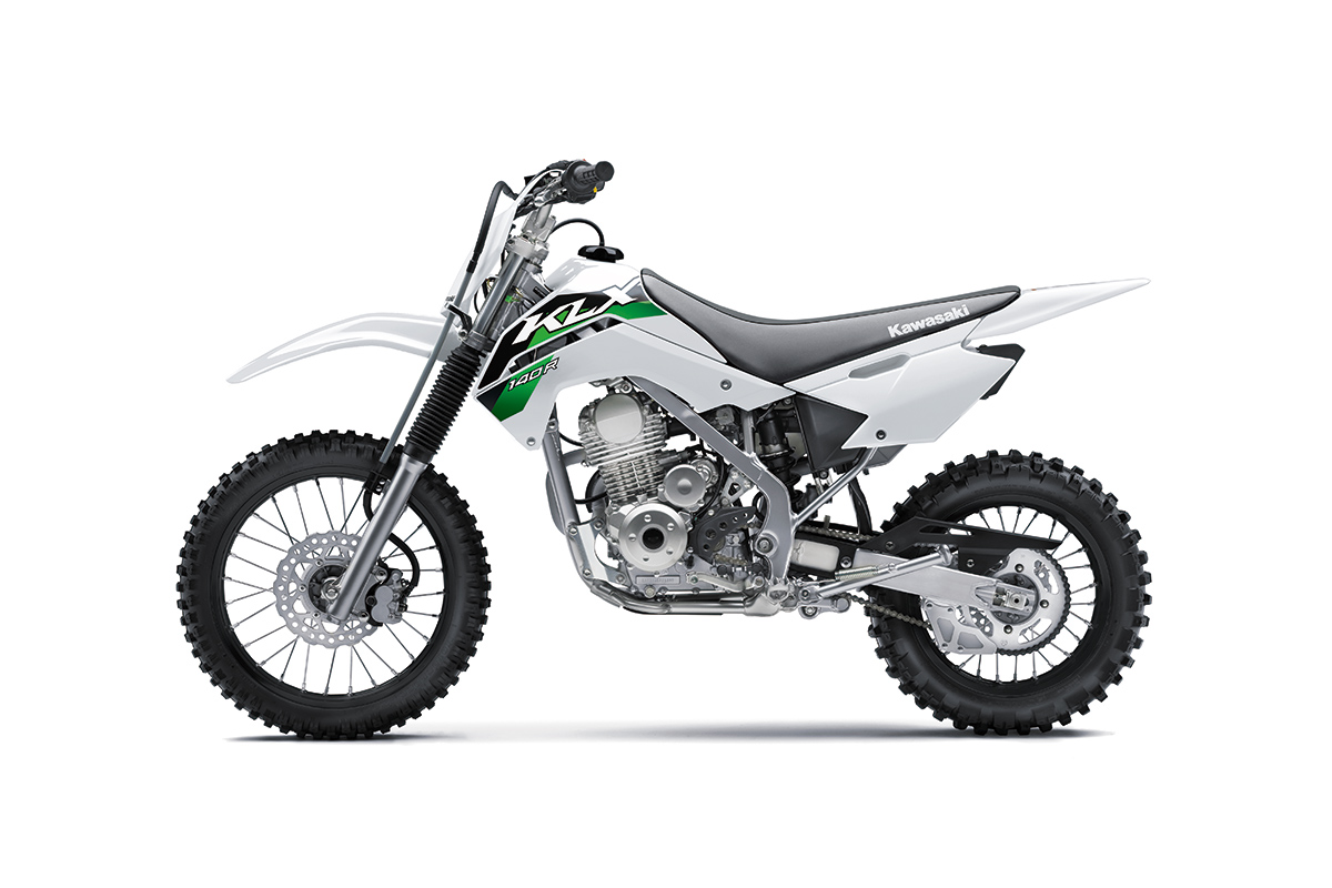 Side angle of a silver motorcycle staged in a white studio background.