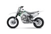 Side angle of a silver motorcycle staged in a white studio background.