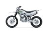 Profile angle of a silver motorcycle staged in a white studio background.