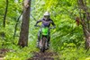 Front angle of a person riding a motorcycle off-road.