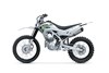 Side angle of a silver motorcycle staged in a white studio background.