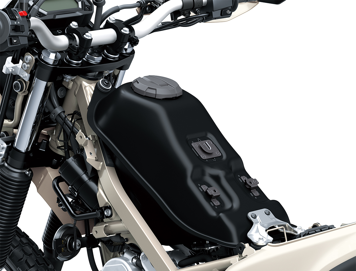 Close-up view of the fuel tank of a motorcycle staged in a white studio background.