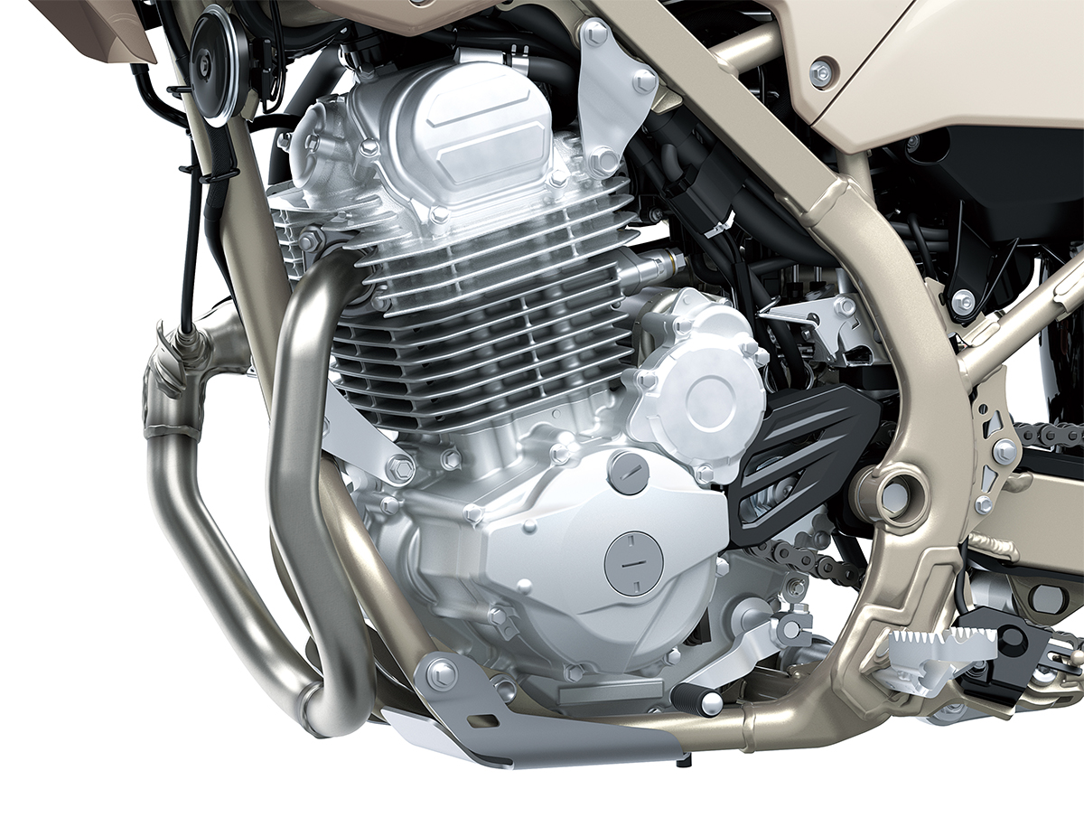 Close-up view of the engine of a motorcycle staged in a white studio background.