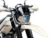 Close-up view of the front fender of a motorcycle staged in a white studio background.