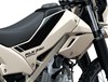 Close-up view of the seat and fuel tank of a motorcycle staged in a white studio background.