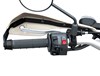 Close-up view of the left handlebar of a motorcycle staged in a white studio background.