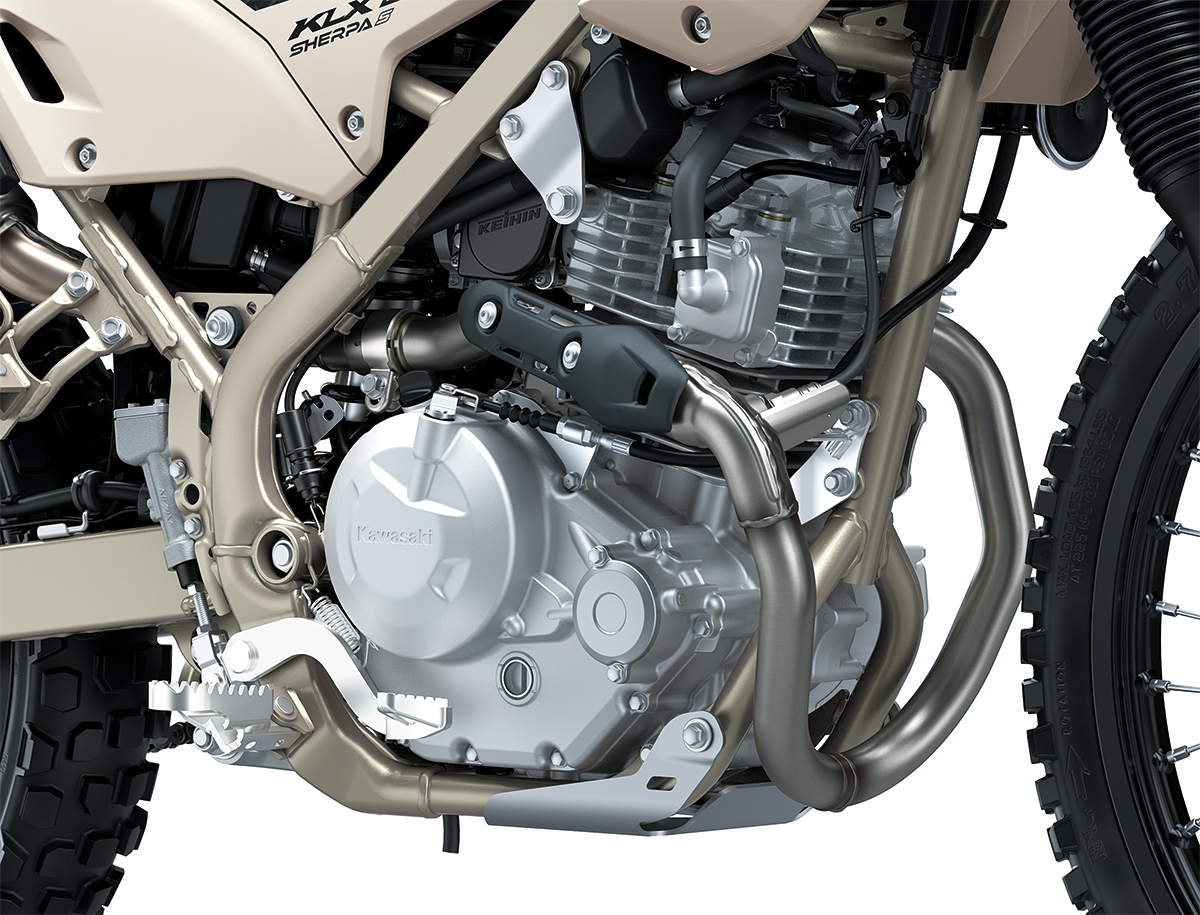 Close-up view of the engine bay of a motorcycle staged in a white studio background.