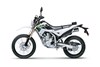 Side angle of a silver motorcycle staged in a white studio background.