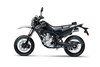 Side angle of a black motorcycle staged in a white studio background.