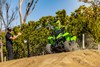 Front angle of a person riding an ATV on a closed course under adult supervision.