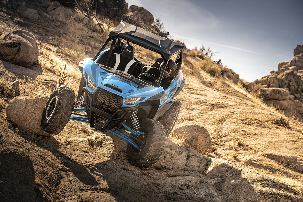 Front angle of a person riding a side x side off-road.