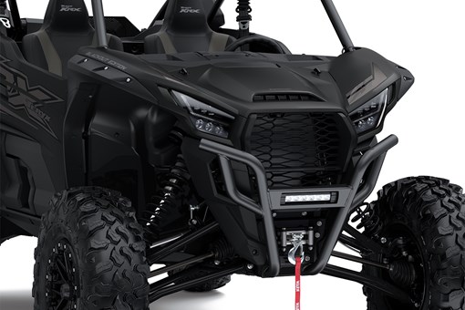 Close-up view of the front end of a side x side staged in a white studio background. opens in a new window