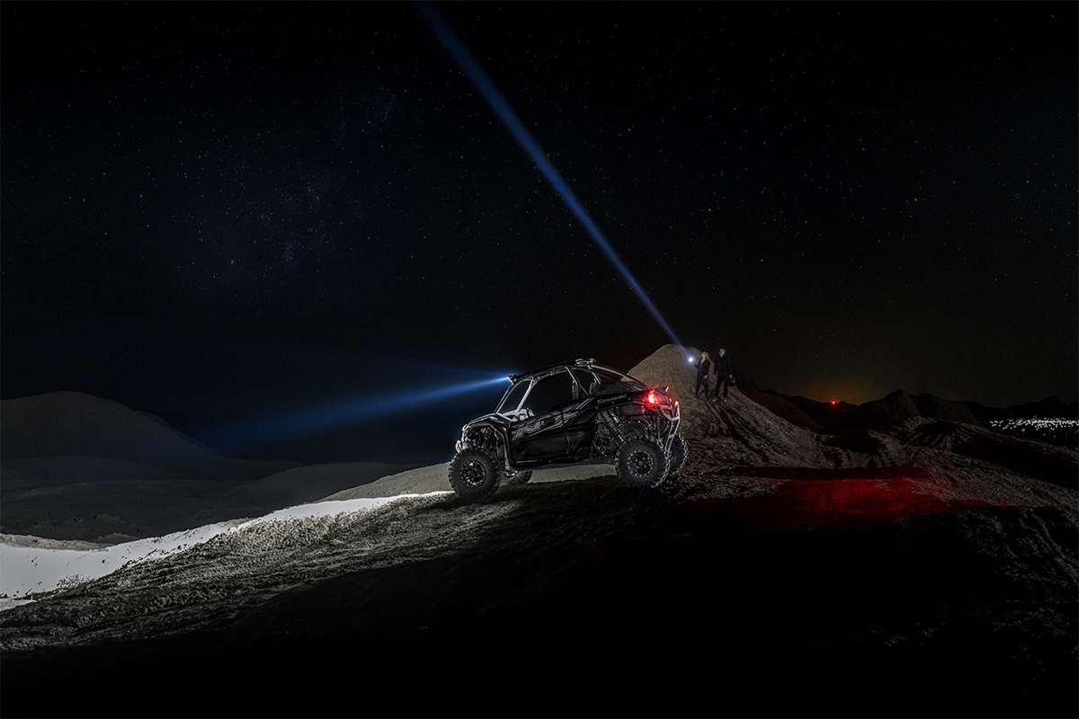 Side angle of a side x side parked off-road.